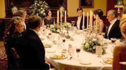 People sitting at a fancy dining table