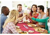 People eating at a picnic table