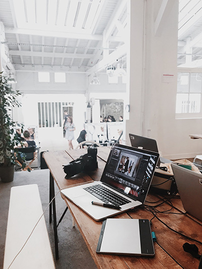 Photo of office space with two laptops on a table